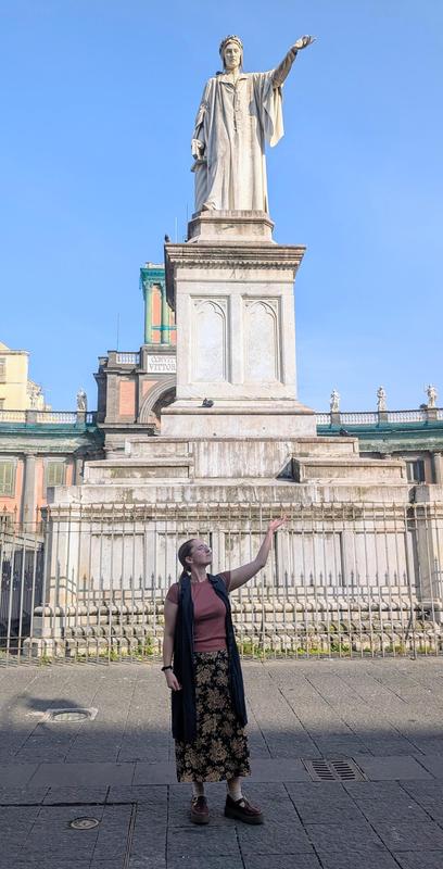 Deaton with a statue.