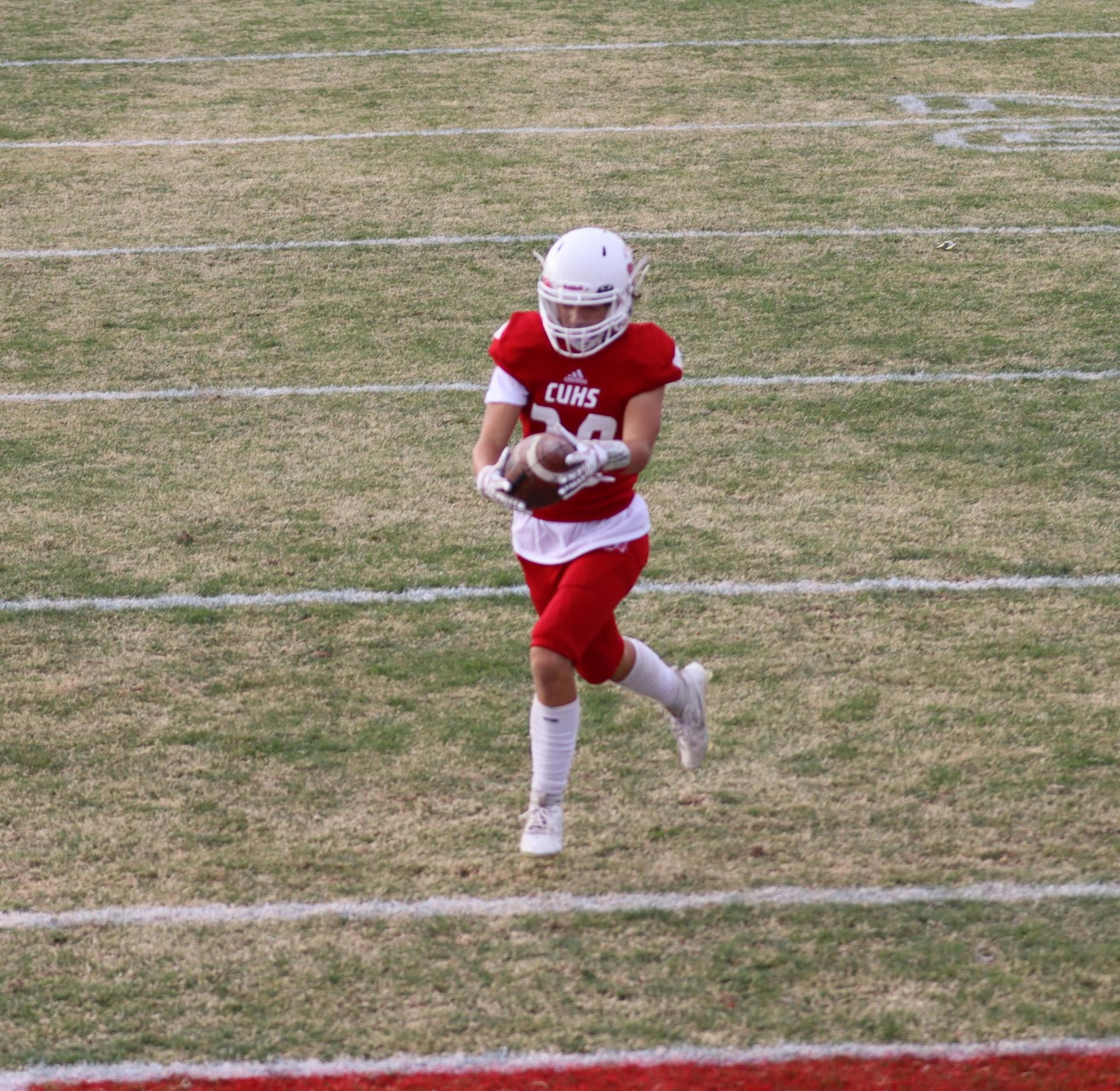  junior varsity football players in action against riverdale