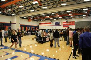 Local business and industry representatives speak with students during the Career Fair