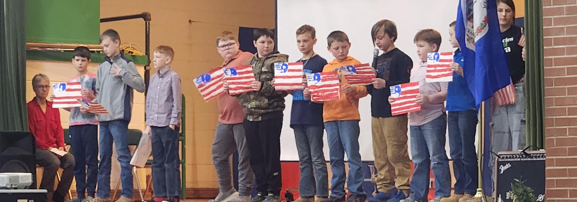 5th-grade students lifted "Voices of Gratitude" during the Veterans' Day assembly