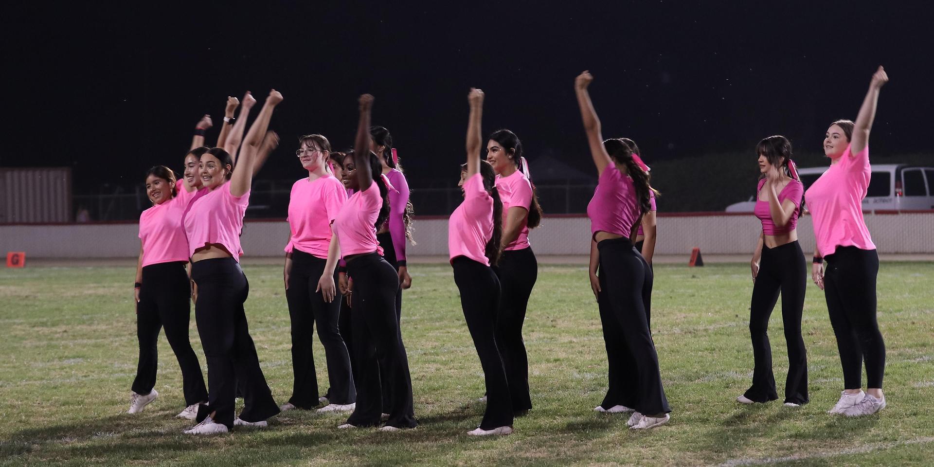 Varsity Cheer performing at halftime vs. Fowler
