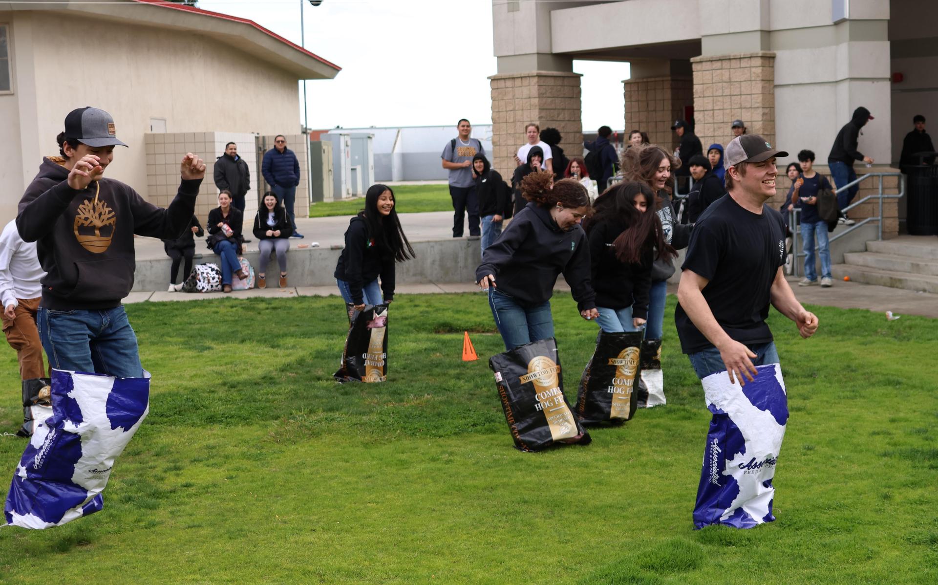 students and staff enjoying the feed bag relay