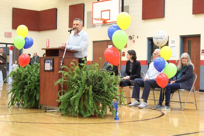 teacher speaking at podium