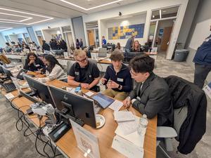 several students working at the competition.