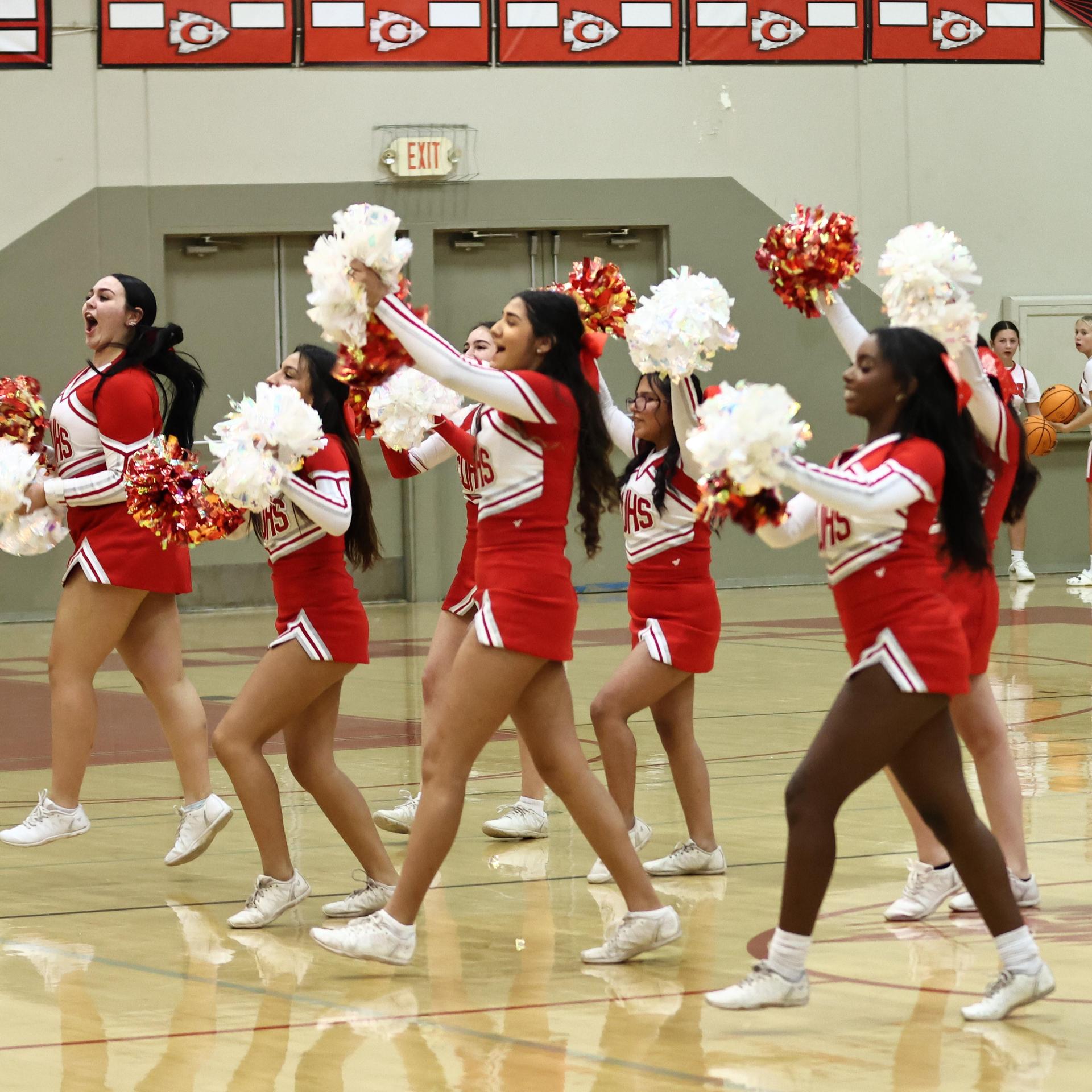 Varsity boys playing basketball against yosemite