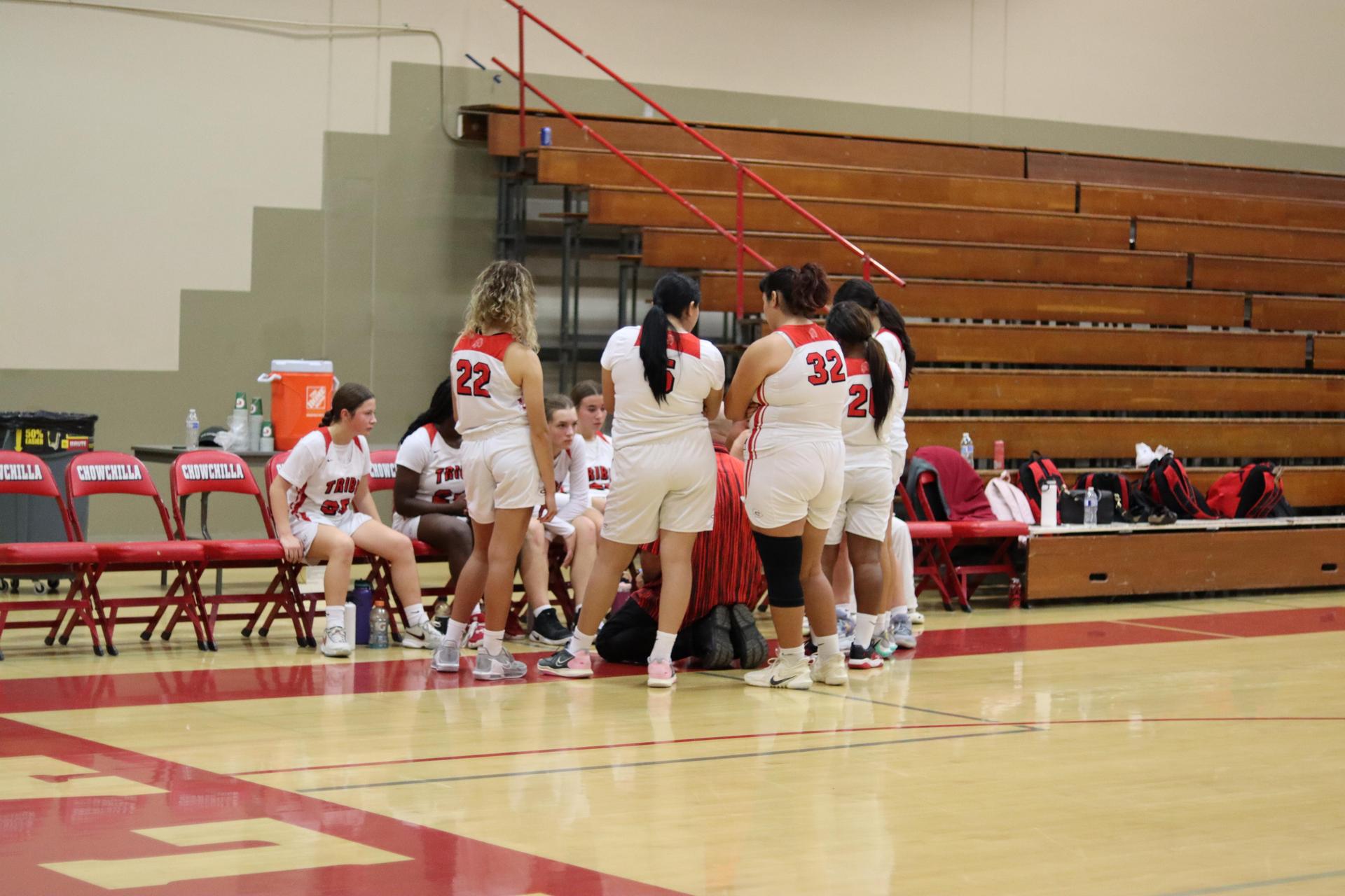 varsity girls playing basketball against mclane