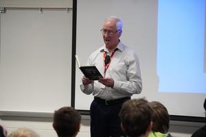Author David Stricklen reads a passage from one of his books.