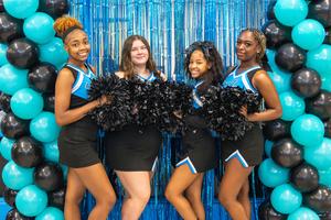 Cheerleaders welcome staff for Opening Day