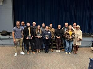 Adults standing and posing