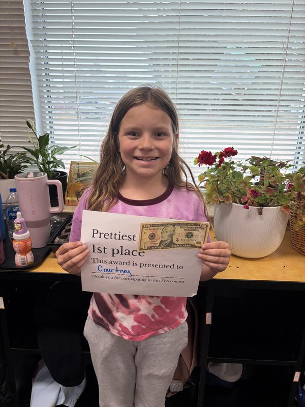 Student showing off her award.
