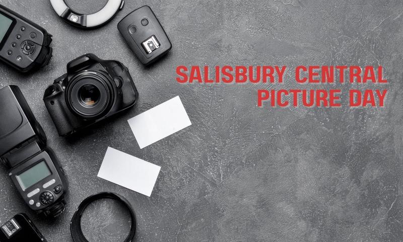 Camera equipment laying on a gray background