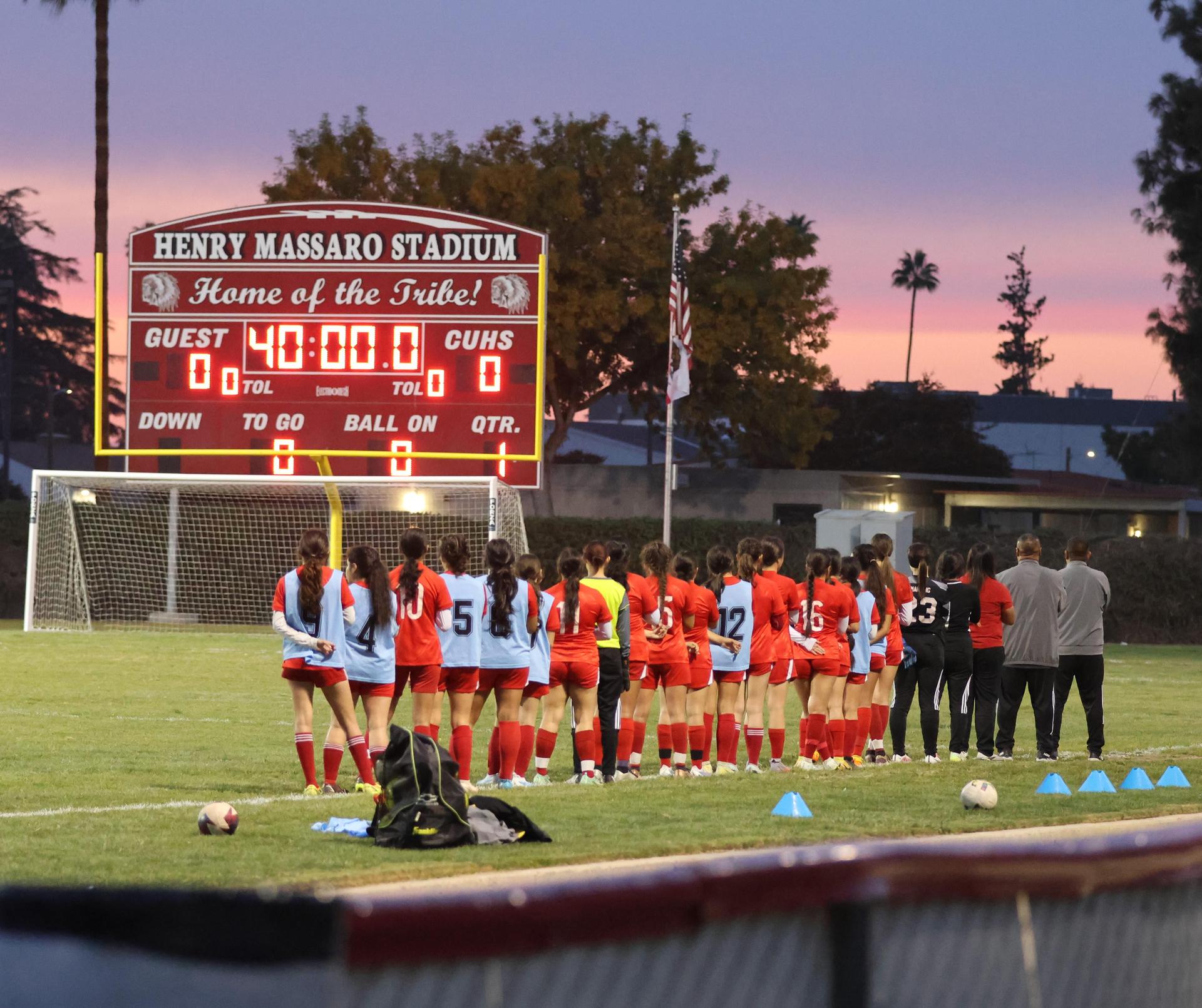 Varsity girls playing soccer against sunnyside