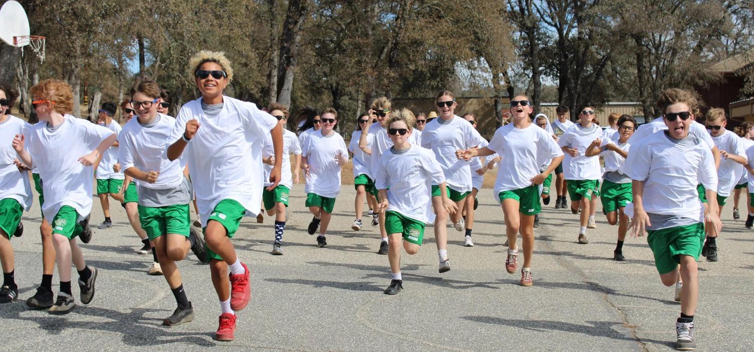 Studentst running at the start of the Color Run