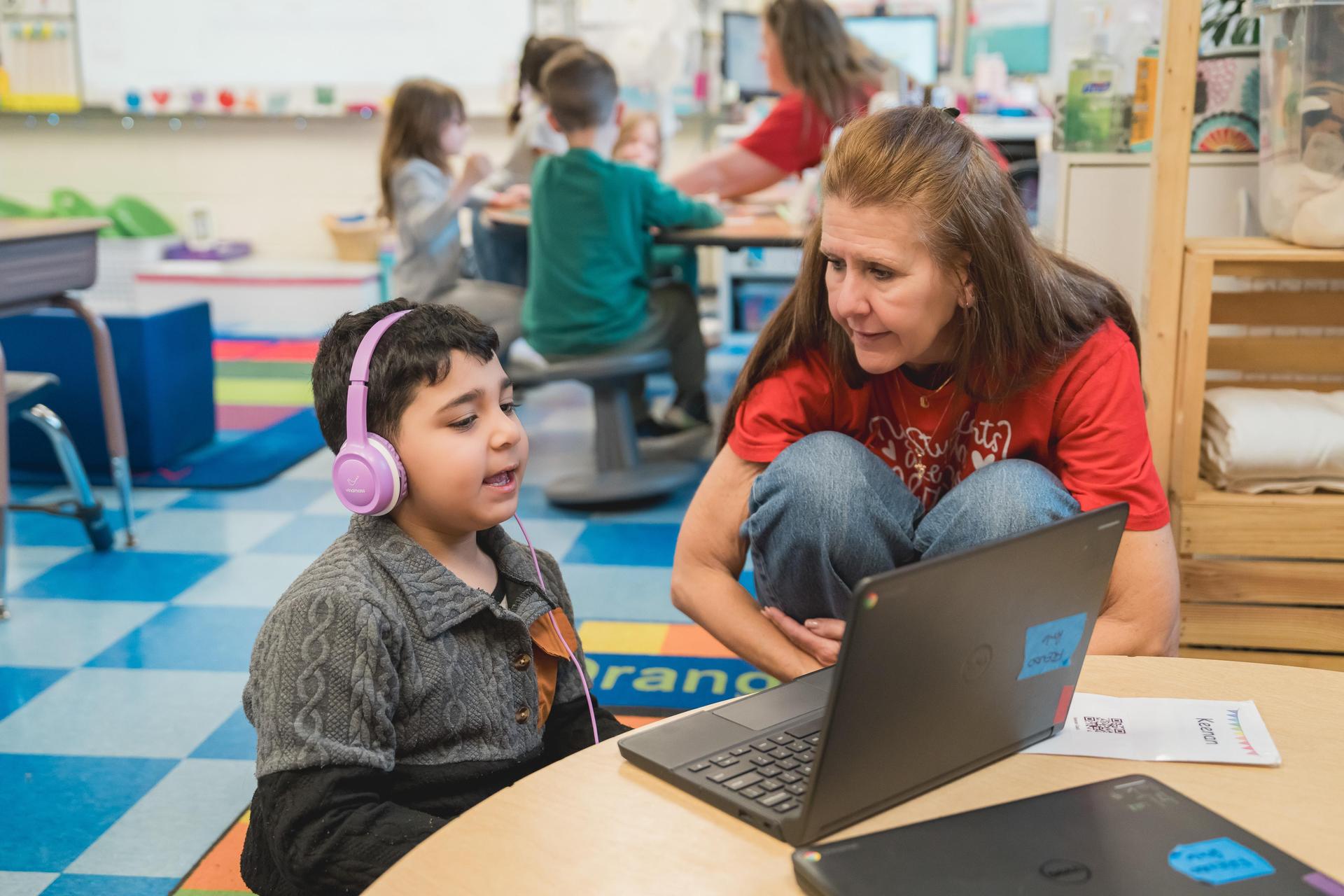 Polk ES teacher working with student to support the district's vision
