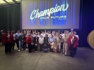 Smiling students with awards