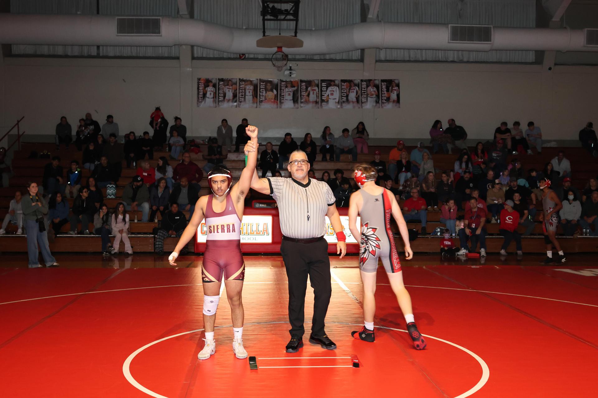 Wrestling winners with hands up 30