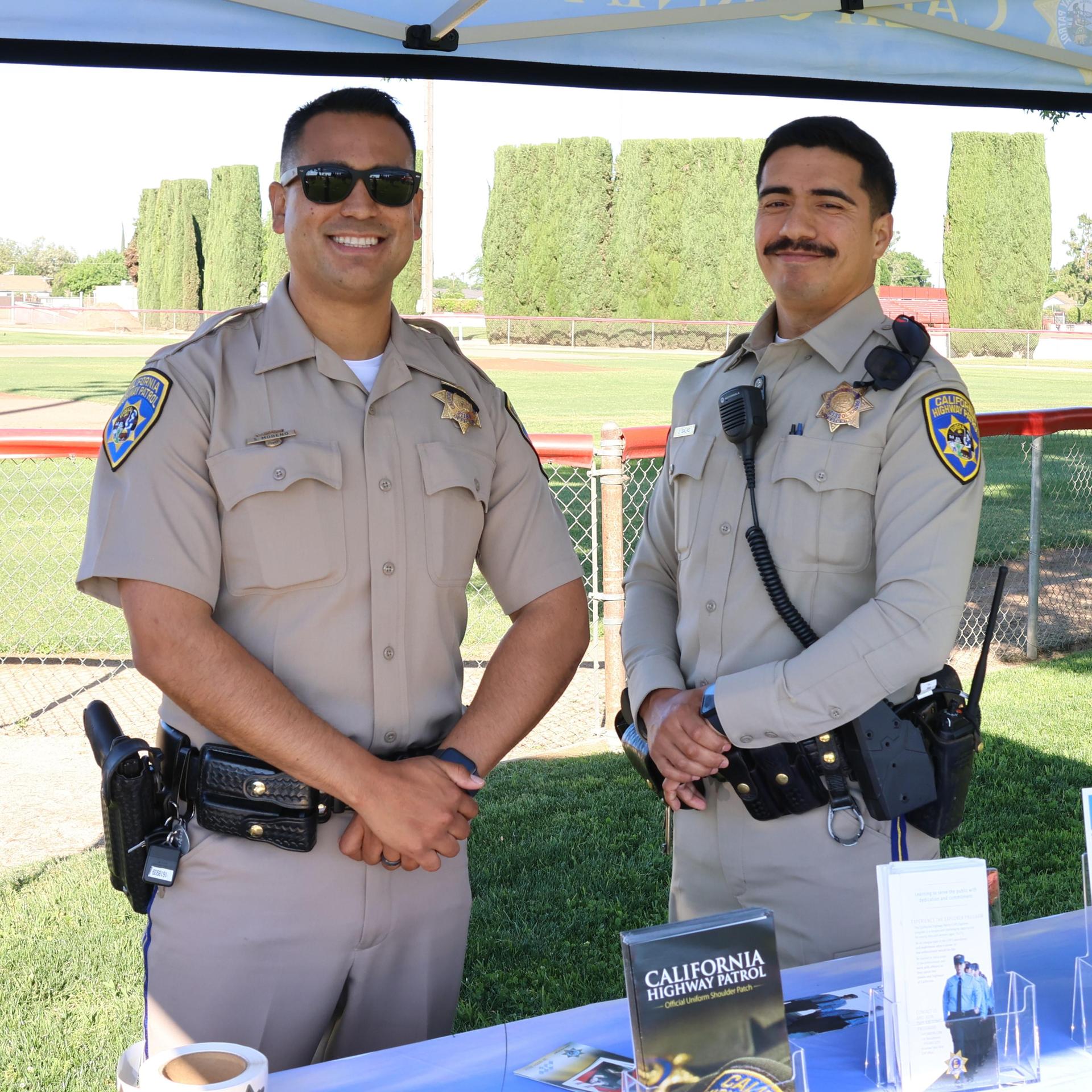 Highway patrol officers speaking to students