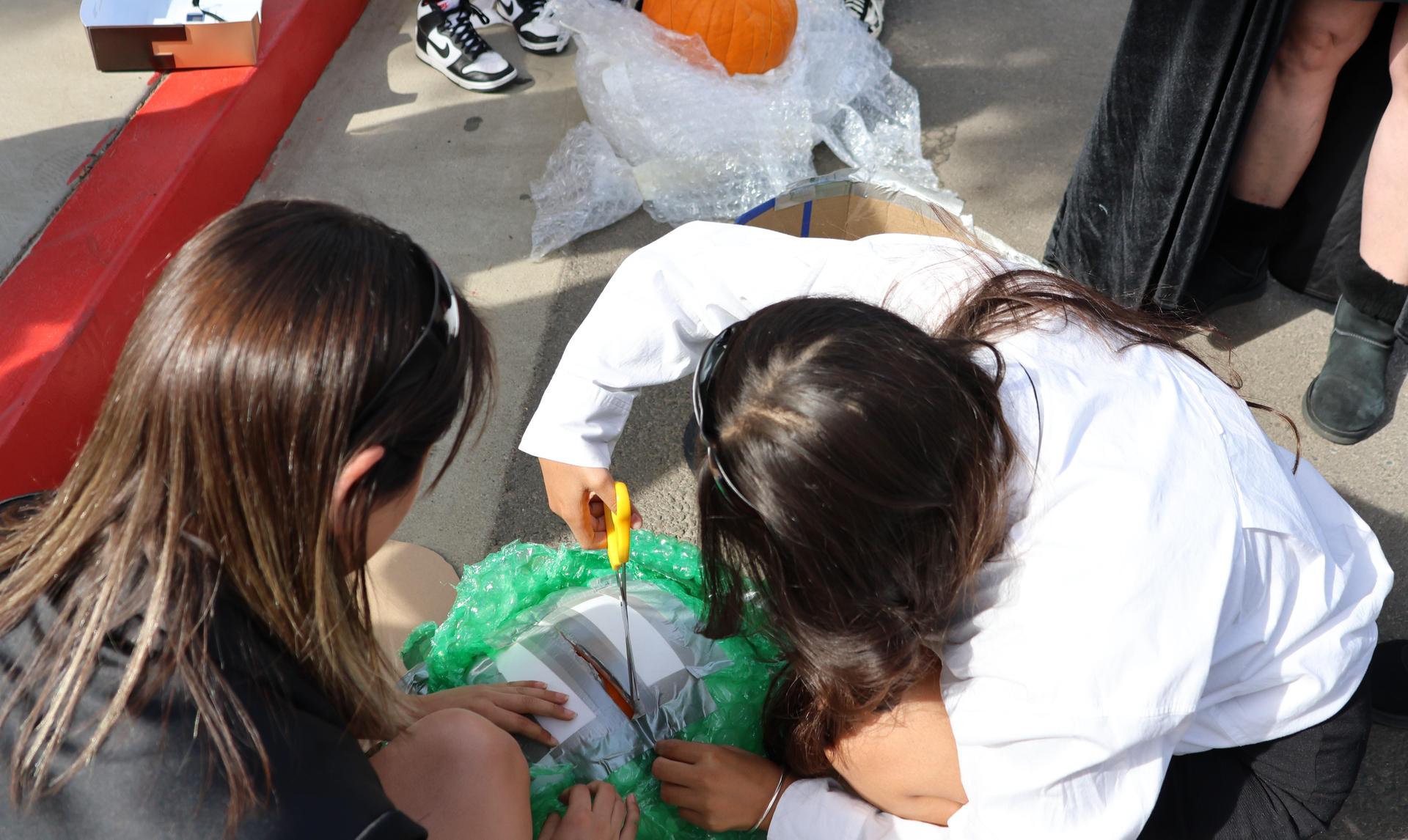 students and staff enjoying the pumpkin drop