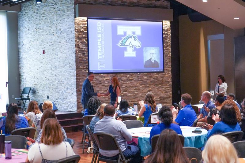 Dr. Bobby Ott welcomes a new teacher during new teacher induction