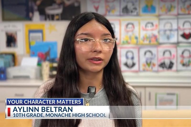 Monache High School sophomore Aylinn Beltran speaking during a TV news interview about her work volunteering with special education students.