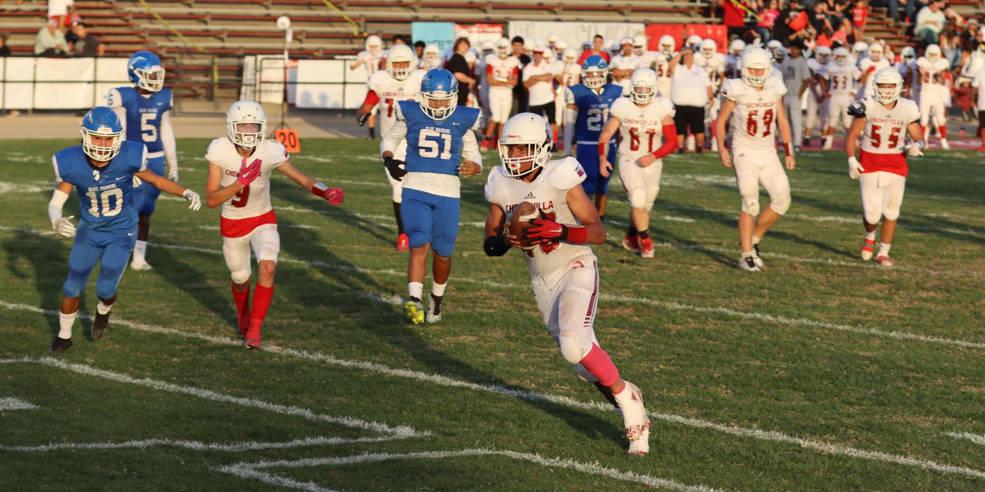 Junior Varsity football players in action against Caruthers