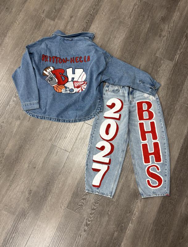 A denim jacket and jeans with artistic designs celebrating BHHS and the year 2027.