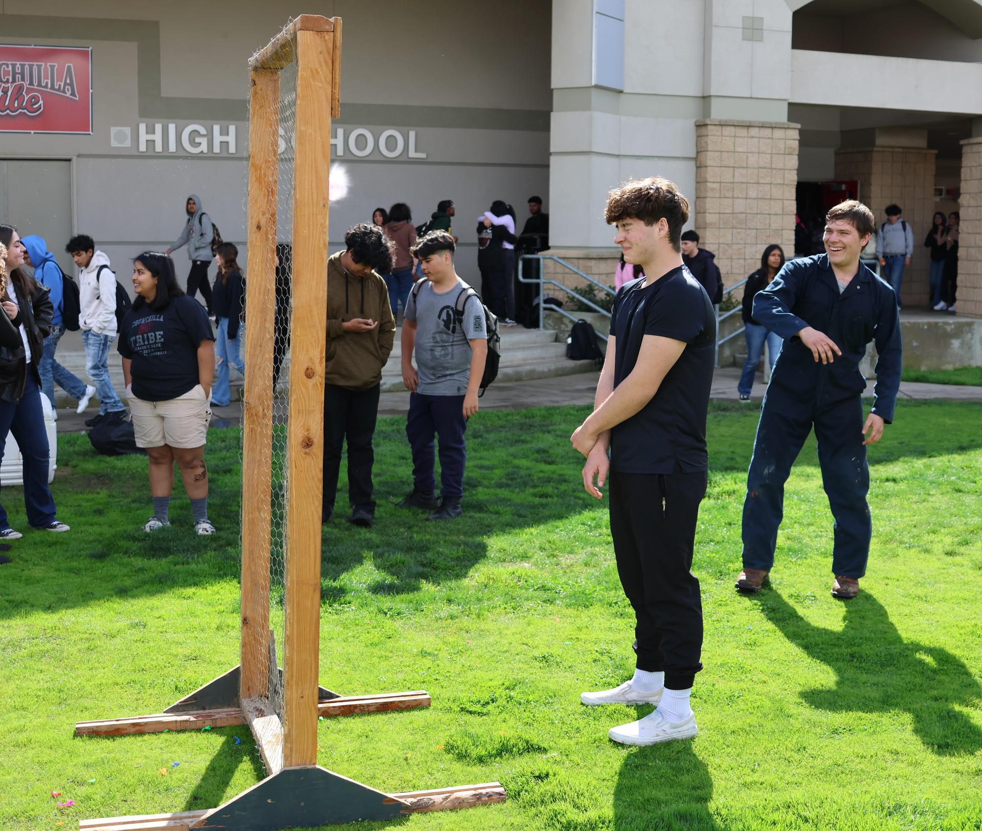 students and staff enjoying the water balloon toss