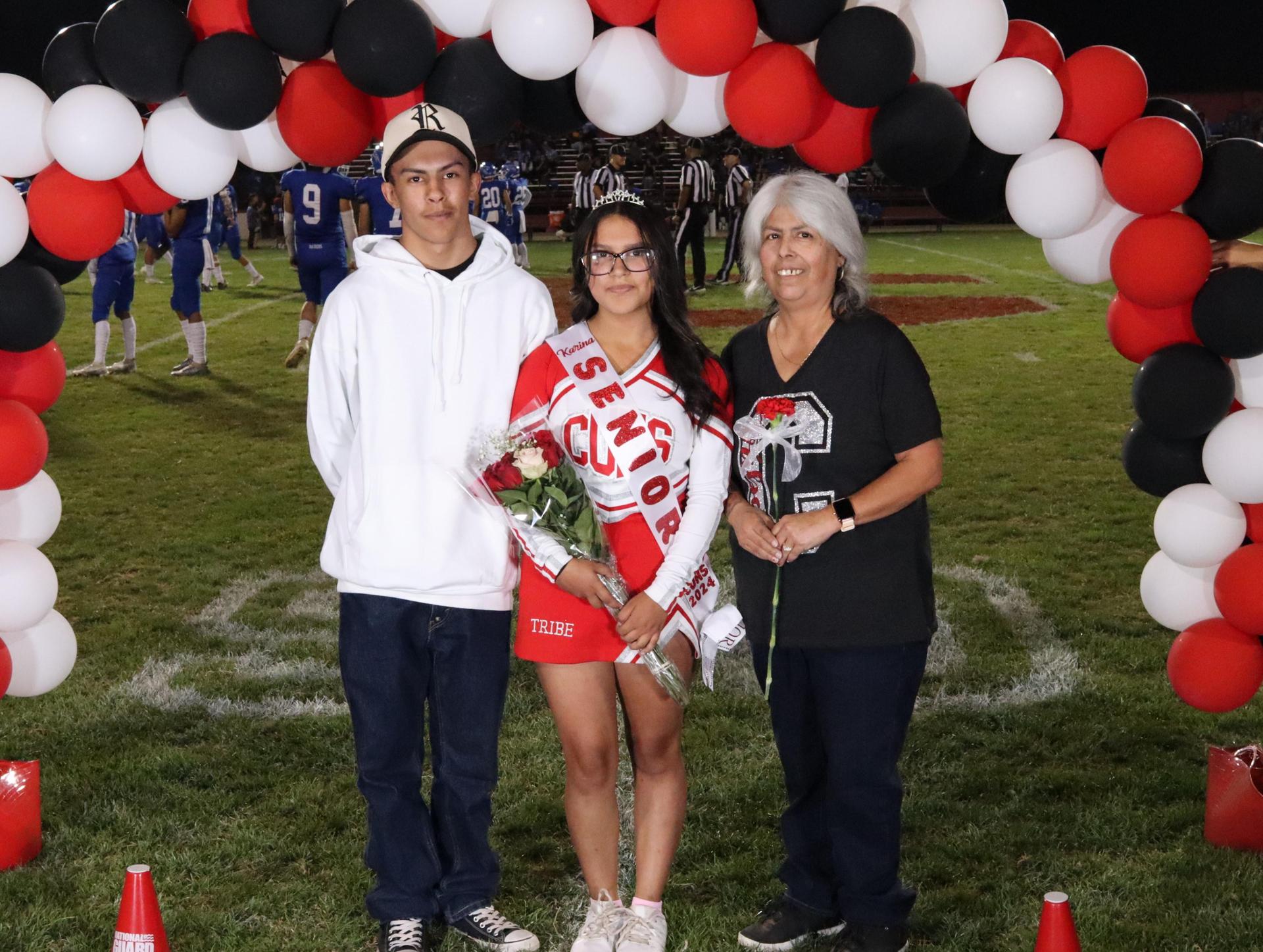seniors and their escorts celebrating senior night