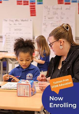 HSA Lorain South student and teacher working together in classroom