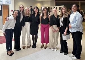 eight people lined up for photo