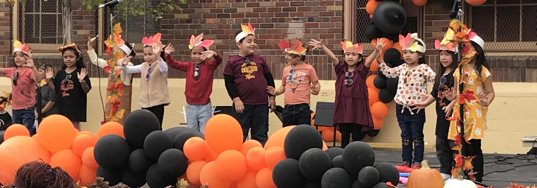 Students signing and dancing in Fall Musical Performance.