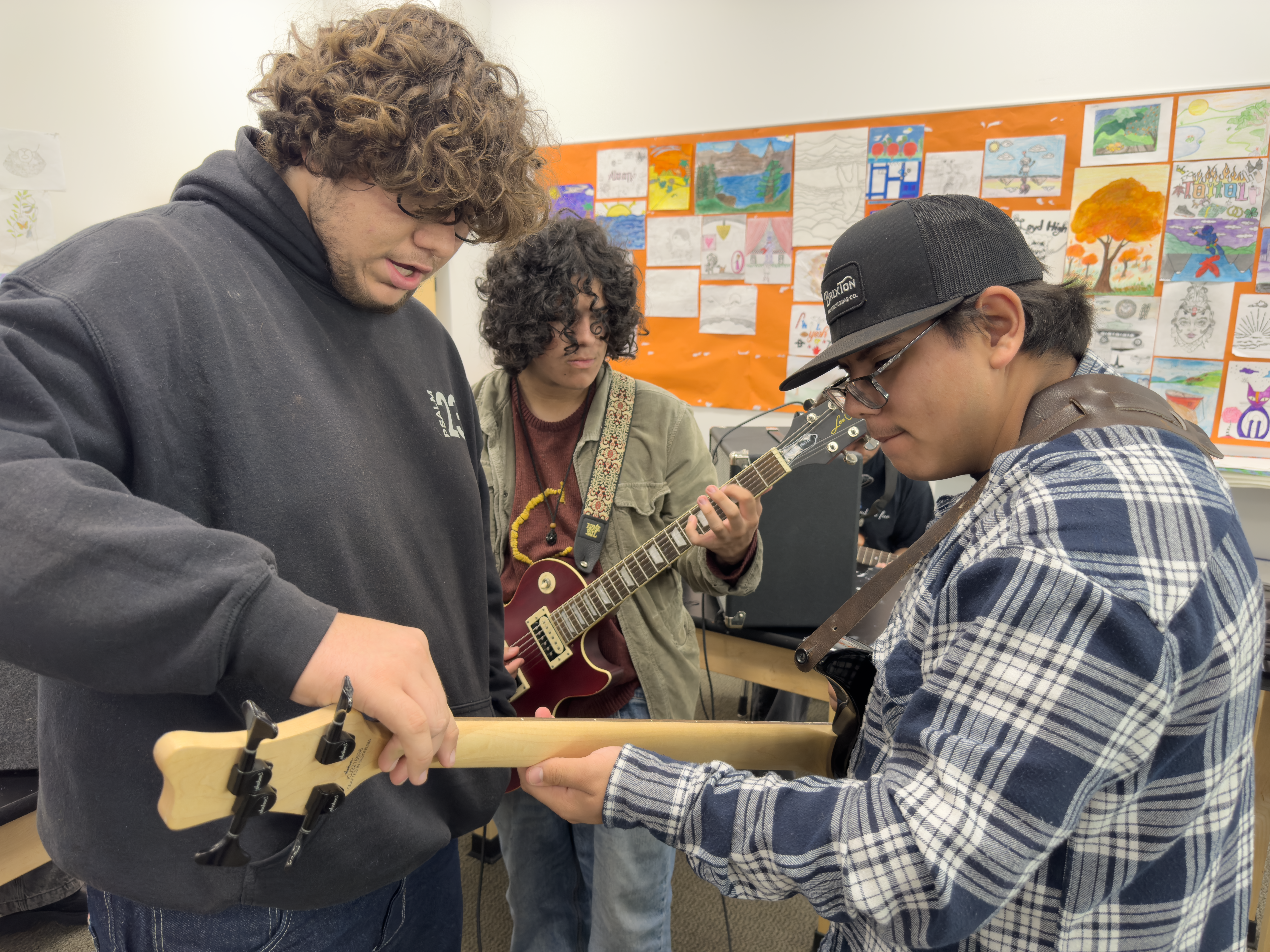 Students playing guitar