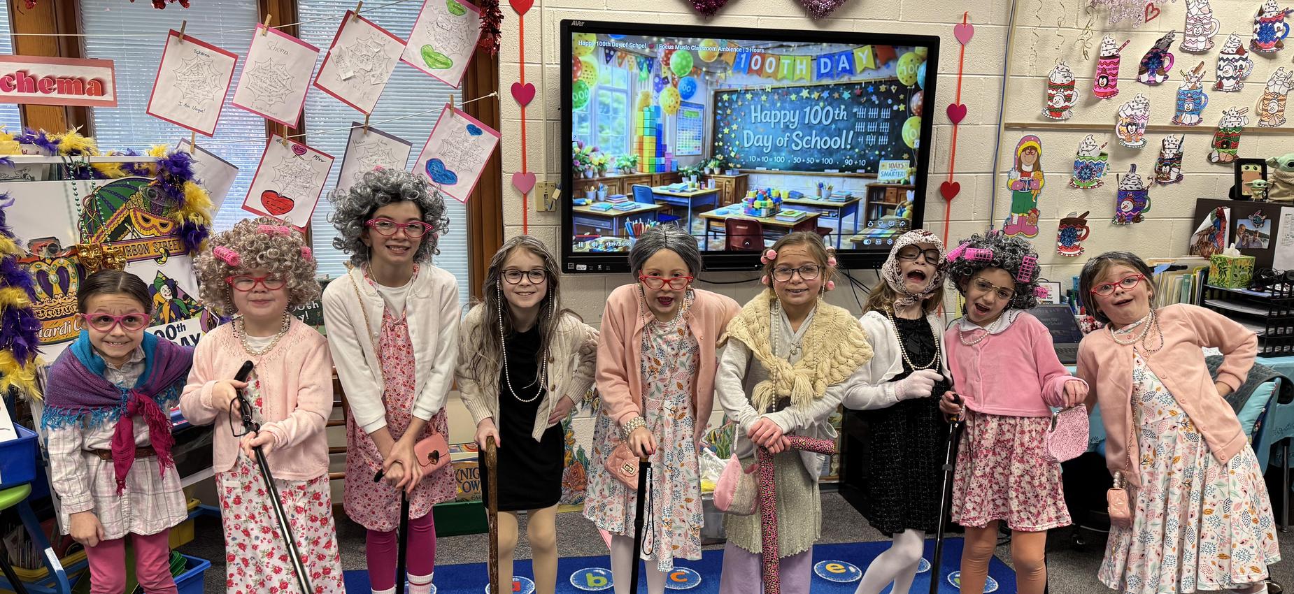Students dressed as elderly characters, celebrating 100th day of school.