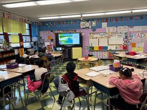 Students attending a presentation to learn about waste