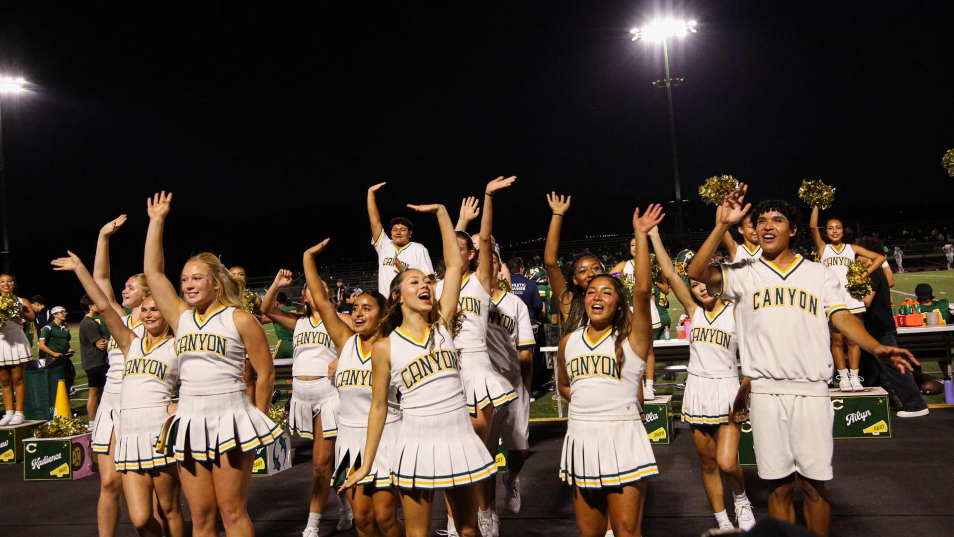 Cheer team waving