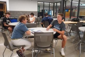 A TKHS teacher mentor volunteer meets her student athlete for the first time.