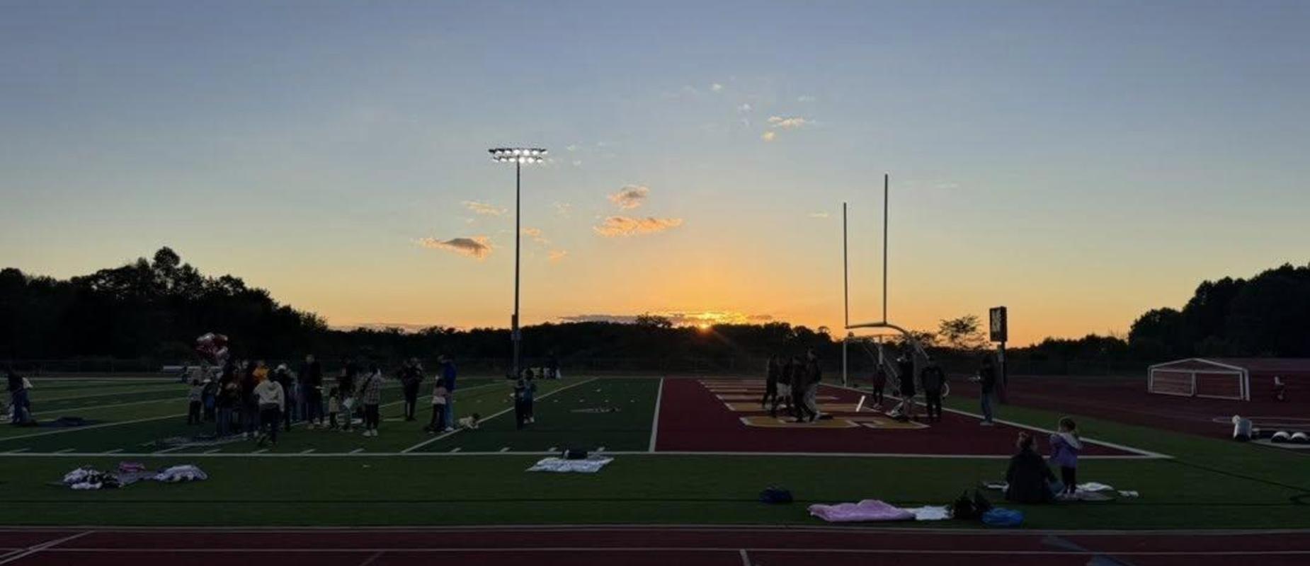 Sunset during the Title I Fall Literacy night at Trojan Stadium