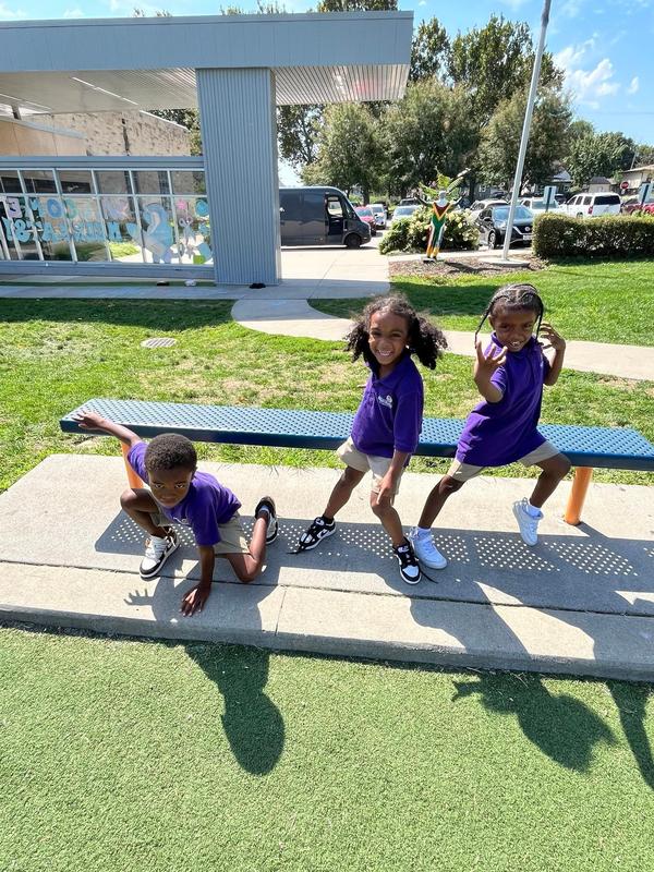 Three scholars on the playground