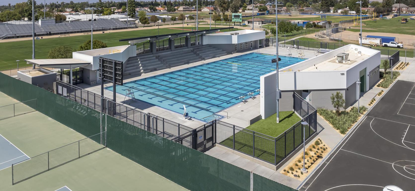 Aerial view of a East Side Aquatic Center surrounded by sports fields.