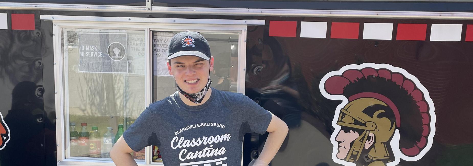 student in front of food truck