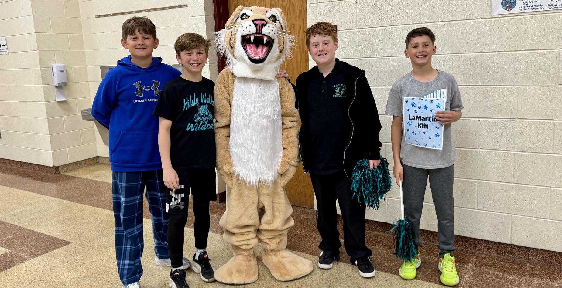 Hilda Walker students and Walter Wildcat ready to greet fourth graders for Step Up Day