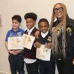 Three children holding certificates standing next to an adult woman.
