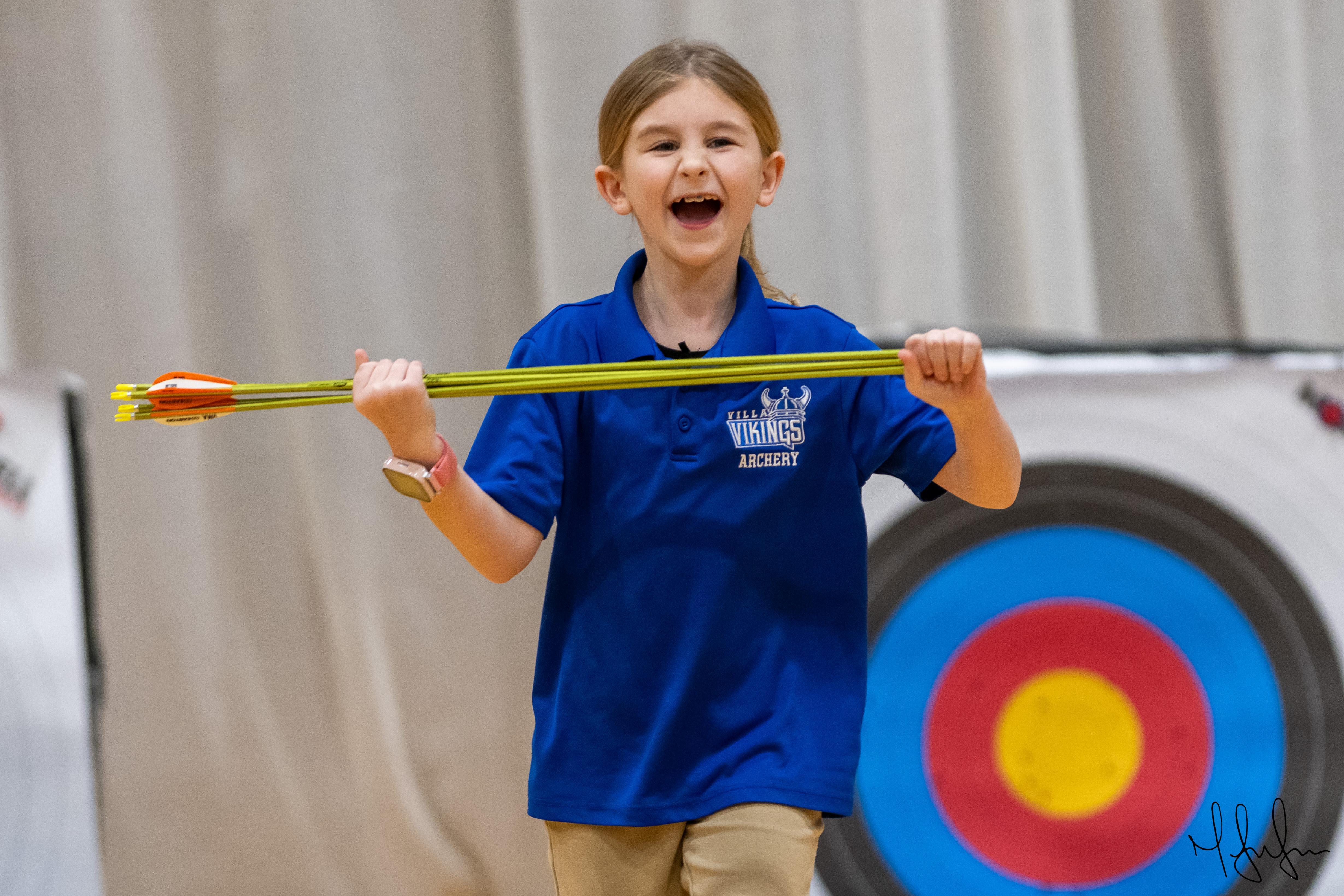Students excited at archery tournament.