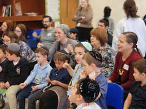 The students listen to the parsha