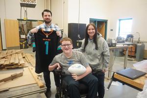 The Smith's gave Nate Boersma a Dolphin jersey and signed football.