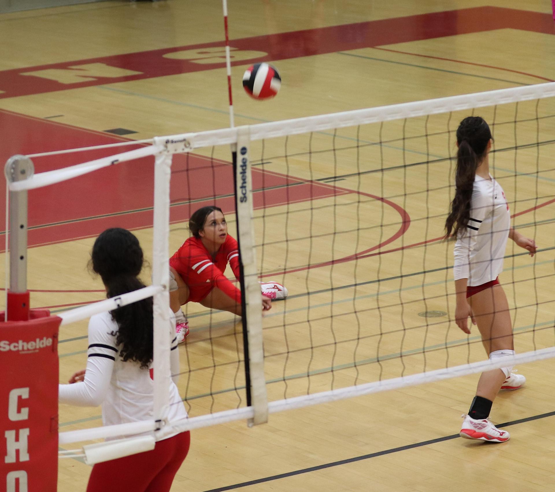 varsity volleyball players in action against Minarets