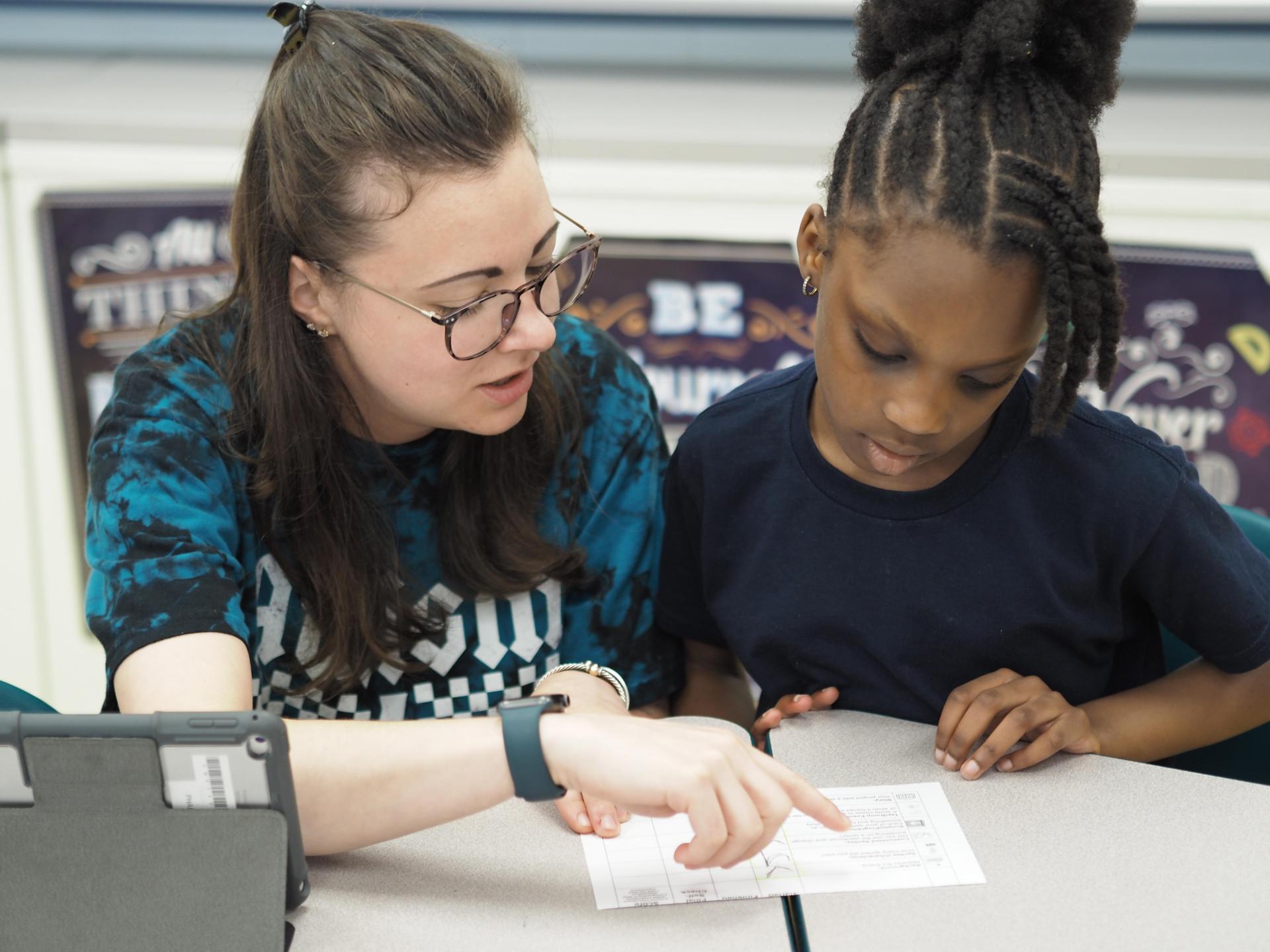 Student Services teacher and kindergarten student