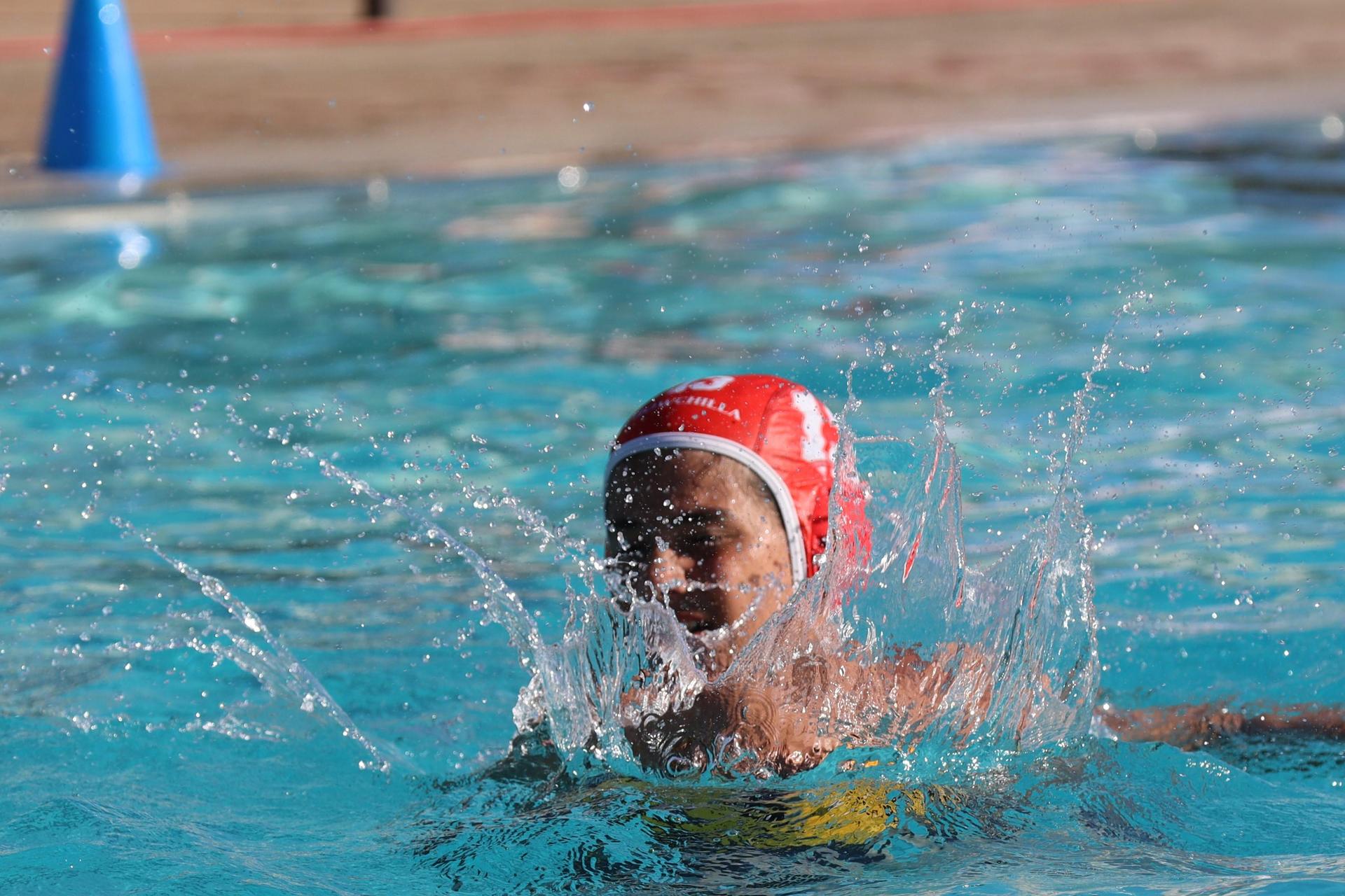 boys playing water polo against Madera