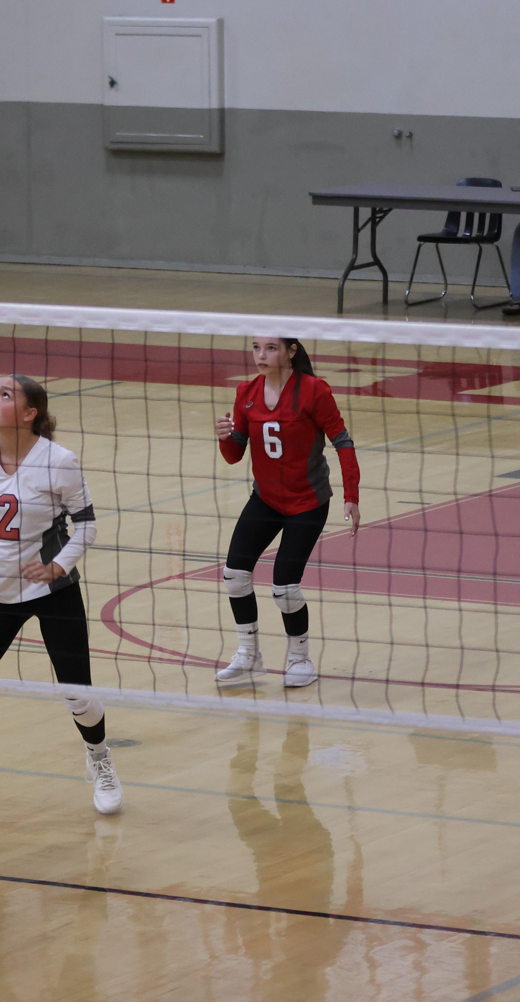 junior varsity girls playing volleyball 104