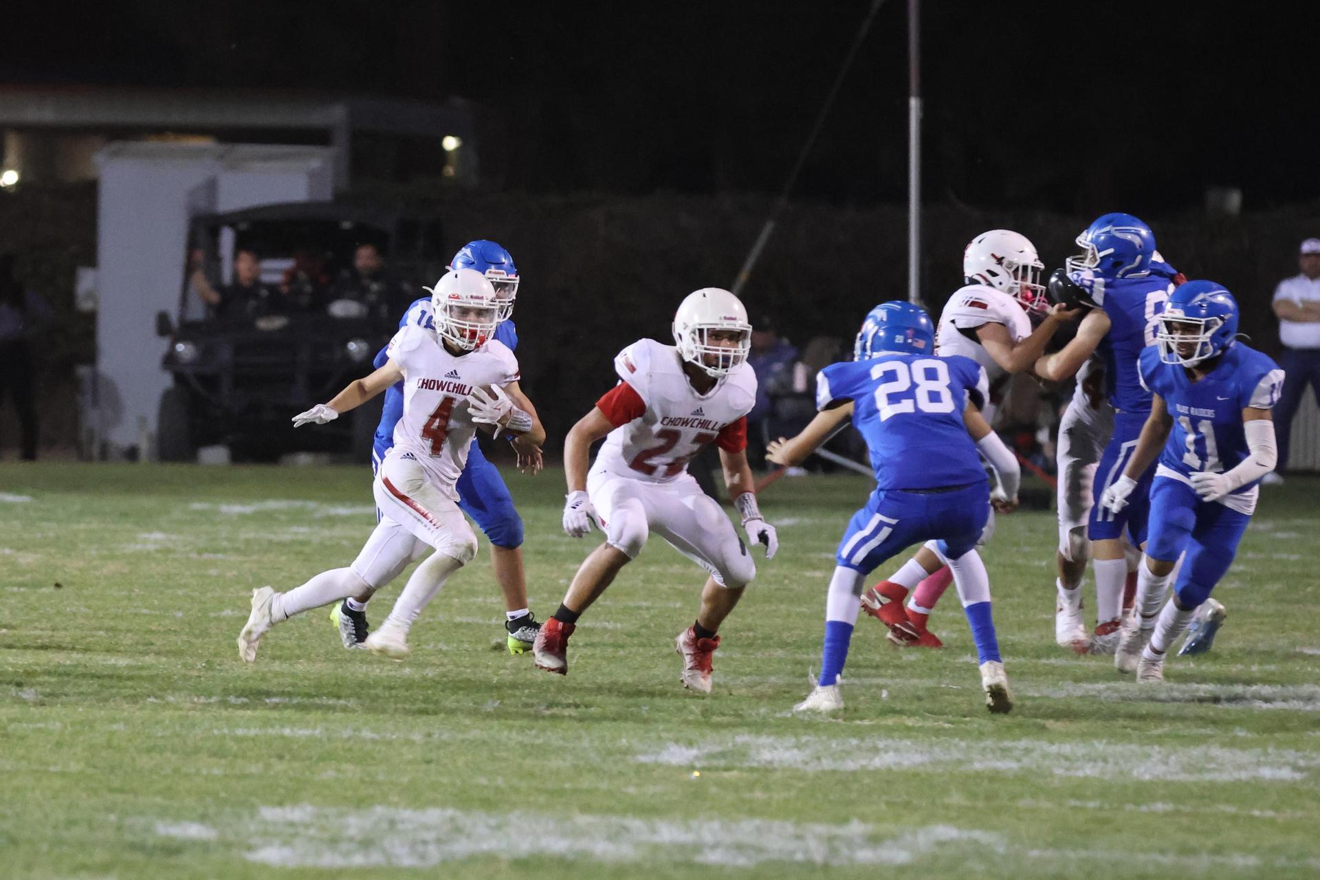 Junior Varsity football players in action against Caruthers
